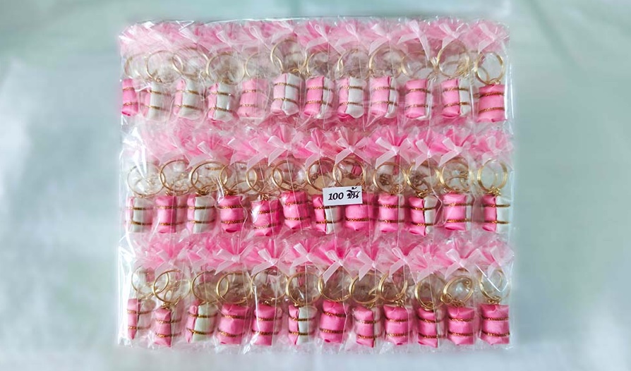 พวงกุญแจข้าวต้มมัดสีชมพูหวาน แพ็กละ 700บาท (100ชิ้น) เฉลี่ยชิ้นละ 7บาท